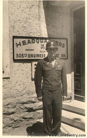 [Photographer in front of 305th Engineer Combat Bn. Headquarters, 80th Infantry Division]