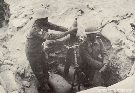 [These British soldiers are demonstrating the method of firing the Italian 81-mm. (3.2-inch) mortar. This mortar can be elevated from 40 to 90 degrees. It has a traverse of 8-1/2 degrees and an effective rate of fire of 30 rounds per minute.]