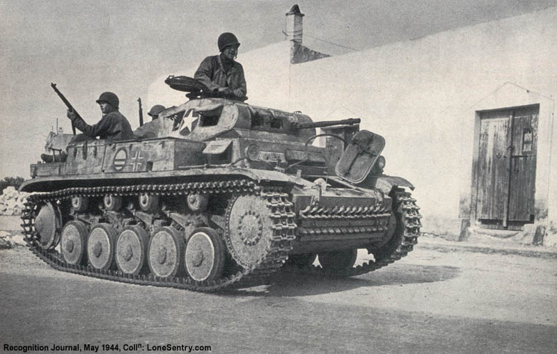 [Captured German Panzer II tank and 8-wheeled armored car]