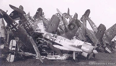 [Luftwaffe debris: wrecked German fighter aircraft]